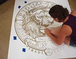 An installer pulls every little detail out of this stencil to prepare for the final colors.