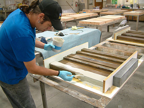 Pulling concrete molds for book panels in Amazon.com's interior walls