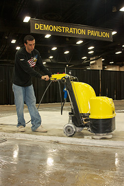 A concrete polisher works on Xtreme Polishing's entry at the demonstration pavillion.