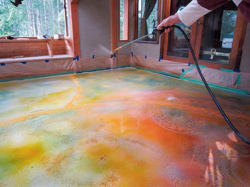 Gary Jones, of Colormaker, sprays his companys Deso Dye over sand and sawdust at the home of his customer, renowned sculptor Thomas McPhee, on Salt Spring Island, British Columbia.