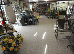Entrance to a grocery store where decorative concrete was placed on the floor and sealed.