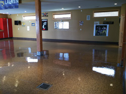 High-gloss concrete floor with a pillar in the middle.
