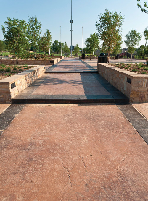 Large textured colored concrete walkway in Texas