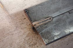 A typical weld from a flux-cored arc welder. This is residue left behind by the gases and flux. It is easily removed with a wire brush and minor scraping.