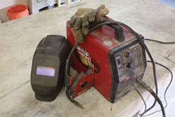 The basics to get started: flux-cored arc welder (with MIG conversion), welding gloves, welding mask (auto-darkening recommended) and magnetic squares.
