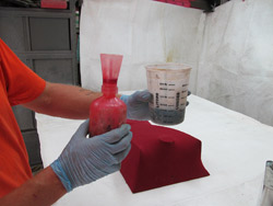 Forming concrete with fabric - Polyester resin cures with heat, not air. Air can slow the curing dramatically, so do not put a fan on sticky resin  it will not help.