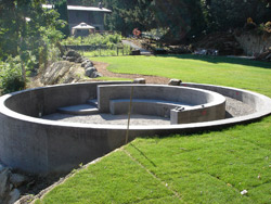 The two-level ceremony circle Brown built for them consists of a circular wall, a short set of stairs that connects the two levels, a half moon-shaped seating structure inside the circular wall and a lone bench next to the seating structure.