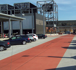 Integrally colored concrete used in a driveway The Harley-Davidson Museum, in Milwaukee, Wis., required 500 yards of concrete for this project. The contractor, Titan Building Co., New Berlin, Wis., requested a 6 1/2-pound loading of a custom Increte Systems color to achieve intensity. Photo courtesy of Increte Systems