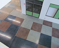 Polished Concrete in a High School - The pattern of colored squares was oriented so that control joints were incorporated to define some of the squares.