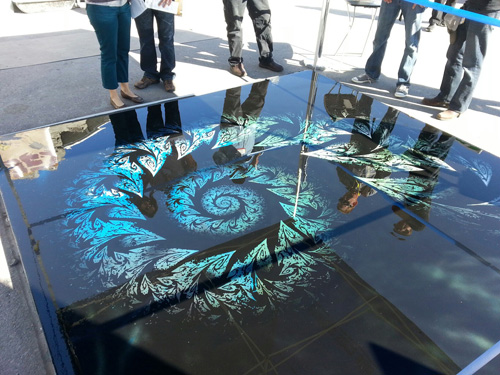 A look at the fractal design created with stencils on concrete.