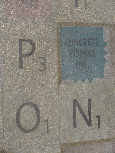 P O and N letters made of concrete to emulate scrabble pieces.