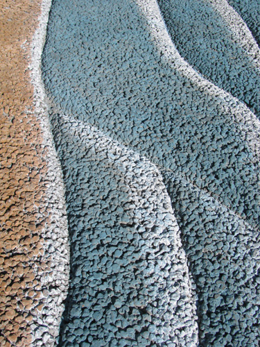 Concrete to emulate the beach and ocean waves.