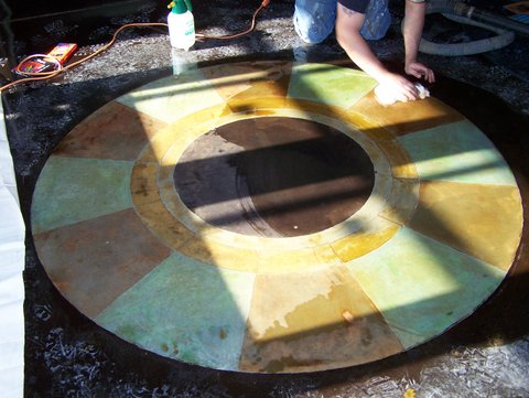 Alternating colors on the wheel of the calendar were achieved with tape and stains.