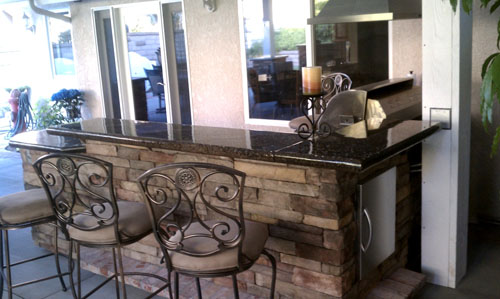 Outdoor kitchen complete with concrete countertops.