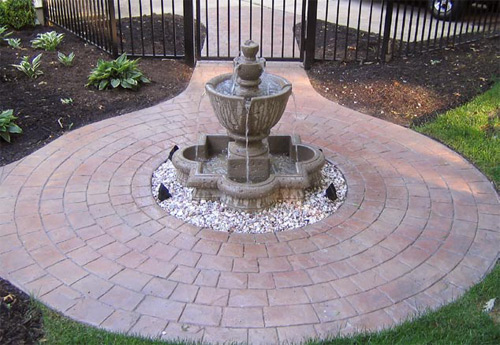 Radial stamps were used in this patio that surrounds this water fountain.