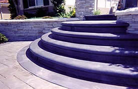A 5 step riser of concrete steps creates an elegant entrance to any home.