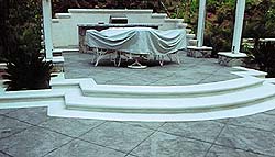 Elevated outdoor living with these radial concrete steps creates a very clean and sophisticated look on any patio.