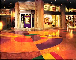 self-leveling overlays can come in a variety of brilliant colors enhancing the boring concrete floor it is placed upon.