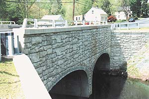 Quaint bridge over small stream with a stone look made from concrete using Increte Systems 