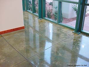 To get this polished concrete looking floor add color to the concrete sealer prior to applying the concrete sealer.