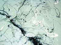 Epoxy coatings can mimic other flooring materials - marble-like epoxy coating in silver, white and black.