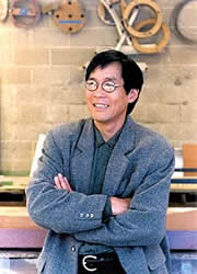 Fu-Tung Cheng stands in his workshop where is designs and constructs concrete countertops and furniture.