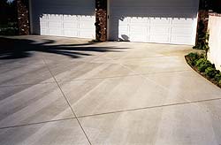 Early entry saw cuts in a concrete driveway removes the boring and gives the concrete pizzazz.