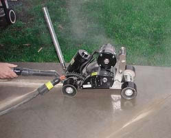 Soff-cut concrete saw cutting into existing concrete for a specialized finish
