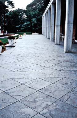 Bomanite materials used to create a diagonal placed tile like surface using concrete stamps, texture skins, and saw cuts.
