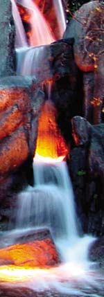 GFRC concrete rocks make this waterfall realistic. An orange glow makes the GFRC rocks look like ember from a fire.