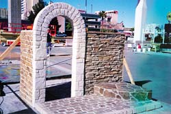Flex-C-Ment Wall Mix is a cementitious coating that is carvable for vertical concrete applications, stone arch made from carving.