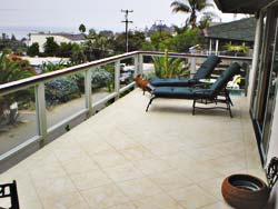 Texture-Crete on a balcony can be used to overlay wood decks and has a fire rating.