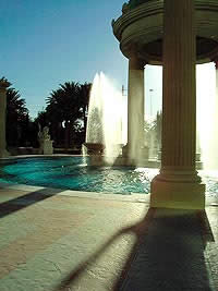 A fountain throws water near a textured concrete area that has been sealed using penetrating sealers.