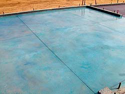 Control joints were created in this blue slab of concrete to help with expansion and contraction