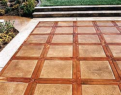 Leave the powder release on stamped concrete for a two or three days so the color gets a good bite into the surface.