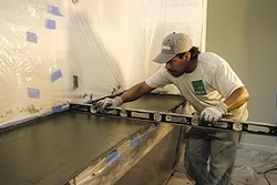 Leveling a concrete countertop after the pour but prior to the concrete curing is important to ensure a level finished product.