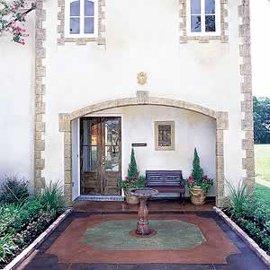 A concrete patio that has been upgrade with acid stained concrete to create the focal point of the fountain.