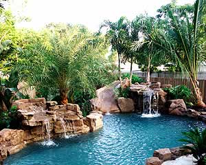 Synthetic rocks take this backyard pool into a beautiful oasis.