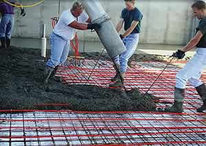 Placing concrete over a radiant heat filled home.