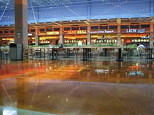 Troweled overlays create a very reflective surface in this airport food court.