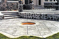 Outdoor patio with stamped and colored concrete done by Julio Hallack of Concrete Innovations