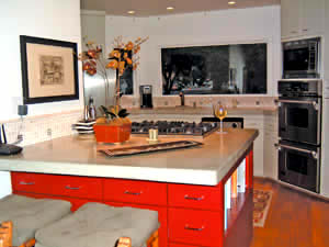 Concrete countertop on a red kitchen island