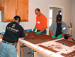 Hands-on education in a real home is a prime way for students to learn how to work with concrete countertops from start to finish.