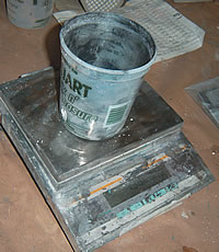 Weighing out the correct coloring and materials is essential for mix design of concrete countertops.