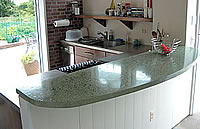 Large bar top kitchen concrete countertop that was precast before installation.