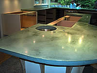 Installing precast concrete countertops puts the finishing look on this kitchen remodel.