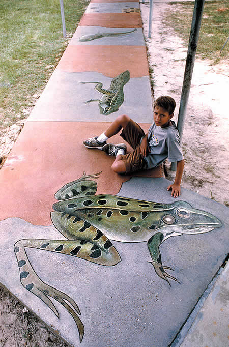 Monarch butterfly and the Southern Leopard frog. Steven Ochs, art professor at Southern Arkansas University, conducted the research and drew the designs, while Gerald Taylor of Images in Concrete used an angle grinder with a diamond blade to engrave the lines. Coloring was done with acrylic and acid stains, and several layers of gritted sealant were used to ensure many years of beauty and protection.
