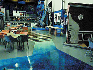 Mikhal Zambon floor design - Last fall Mapei asked us to come help design and install their new showroom in Milan, Italy, which was a lot of fun. We did over 120 samples before the final 22 were selected. The language barrier was somewhat of a challenge, and that English-Italian dictionary I brought was more tourist-related than construction terminology. I could order a mean plate of gnocchi, but I couldn't get a four-inch hand grinder with a quarter-inch blade to save my life!