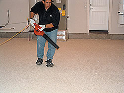 Versatile Liquid Granite Chip Flooring System - The accelerators worked. After the first coat of Versathane started curing, it had the same integrity as if someone had done it without an accelerator in 70°F or 80°F heat, Glendrange said. The edge of the garage was tacky, but you could walk on it.