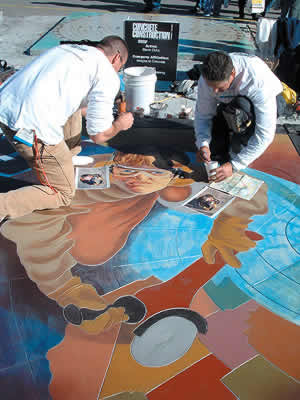 Coloring concrete using colored acrylic water based concrete stains into an image of a concrete contractor using a red and black grinder at the World of Concrete 2005